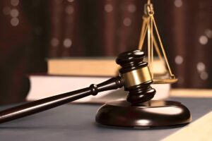 Gavel and scales of justice symbolizing legal authority, judgment, and the pursuit of fairness in the courtroom.