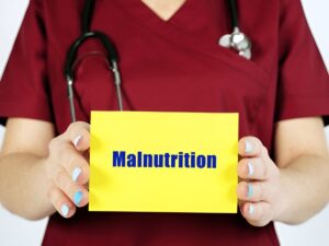 Medical concept meaning Malnutrition with inscription on the page.