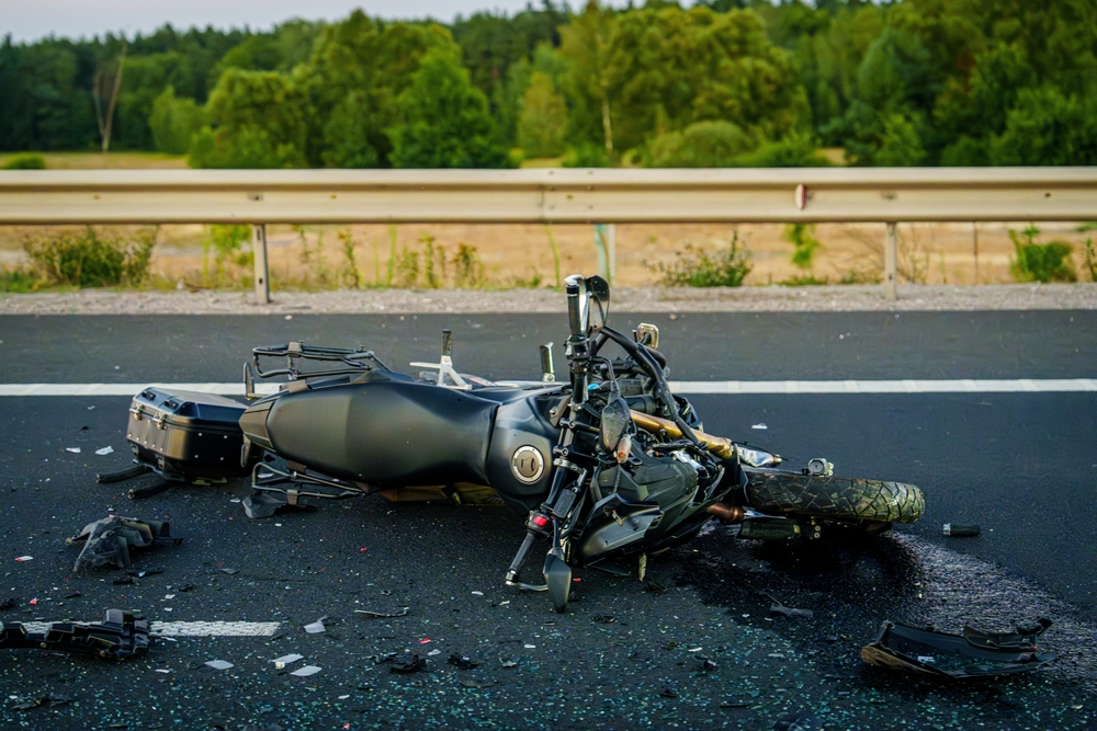 A damaged motorcycle lying on the highway after a serious crash near a South Carolina roadway.