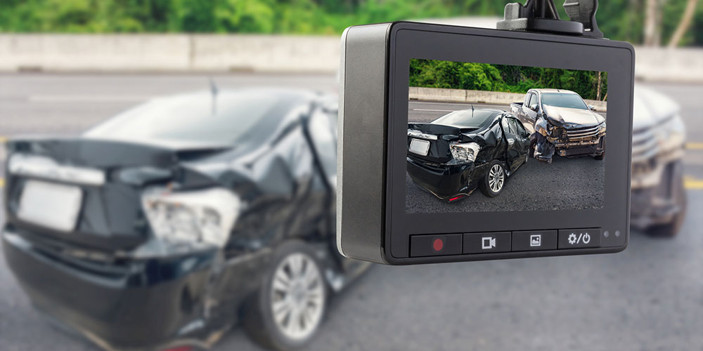 Dashcam or CCTV-style car video recorder capturing a crash on the road, representing the digital evidence that can determine fault in a South Carolina car accident claim.
