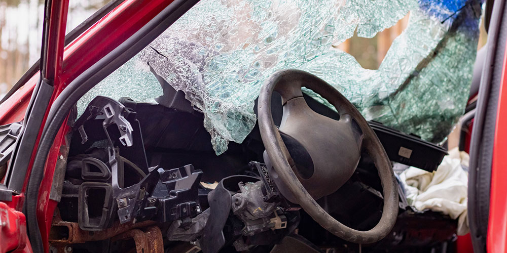 Shattered windshield after a serious car crash, representing the severe injuries and damage often caused by reckless driving in South Carolina.