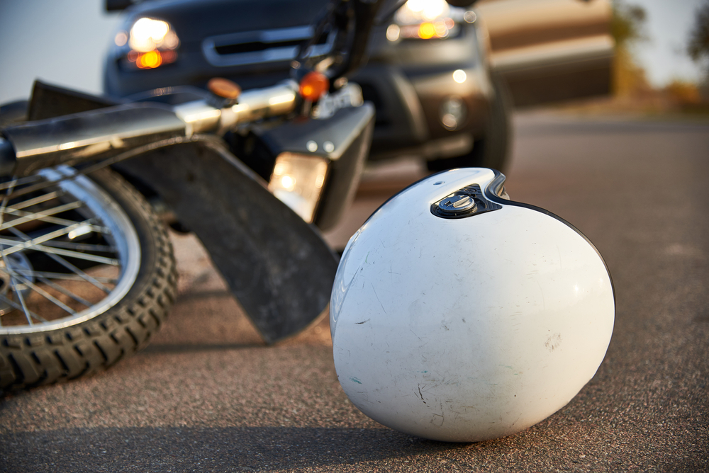 A white helmet and motorcycle lying on the road after a collision in South Carolina.