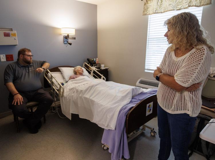 Grandson Joe Smith sits beside his grandmother Shelba Catterton’s bedside along with his mother Sherri Lero at Lowcountry Community Hospice House