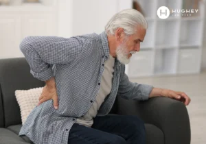 Elderly man experiencing back pain, representing nursing home injuries and spinal cord injury cases in Charleston.